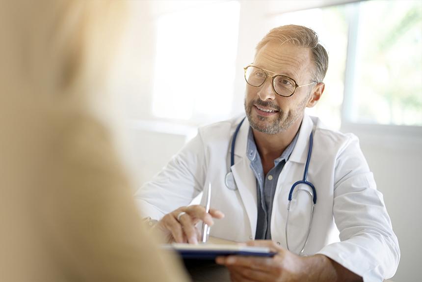 Doctor reviewing resources with a patient.