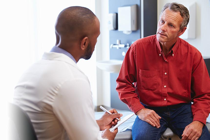 Doctor discussing a prostate-specific antigen test with a patient