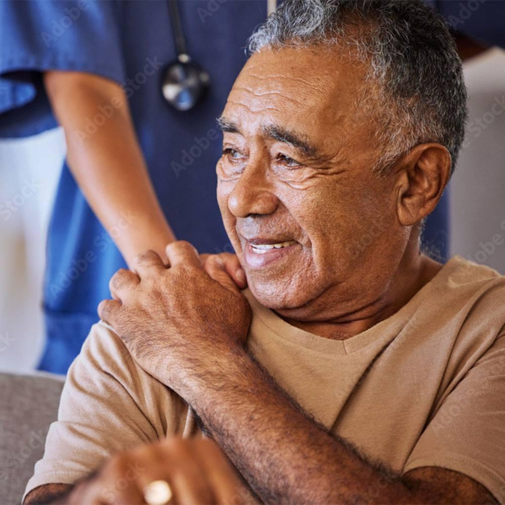 Man being comforted by a nurse