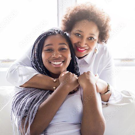 Mother and daughter smiling