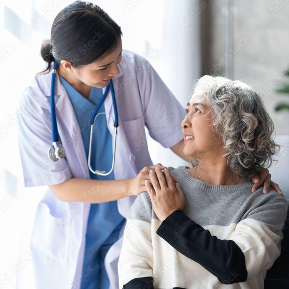 Nurse examining a patient for signs of cancer