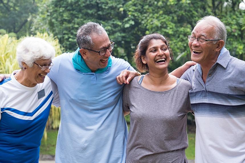 Couples smiling and standing together.