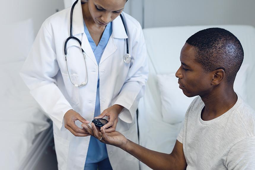 Clinician checking a patient's insulin levels.