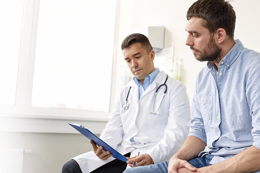 Doctor discussing colorectal screening information with a patient.