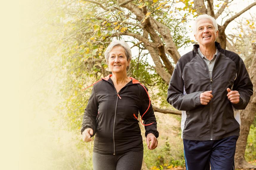 An elderly couple walking as part of their commitment to stay healthy with diabetes