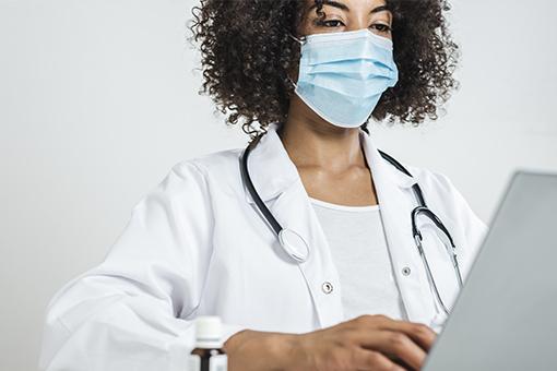 Provider discussing cancer symptoms with a patient.