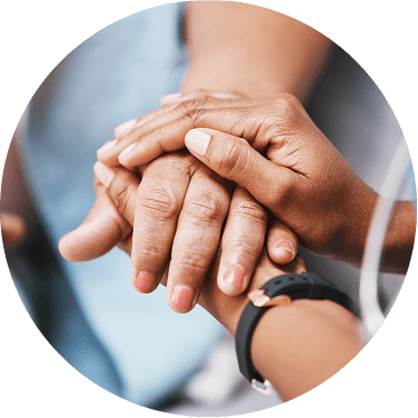 People holding hands in support of each other