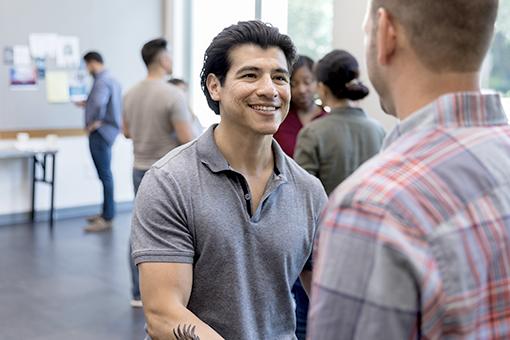 Men talking with a counselor about diabetes management.