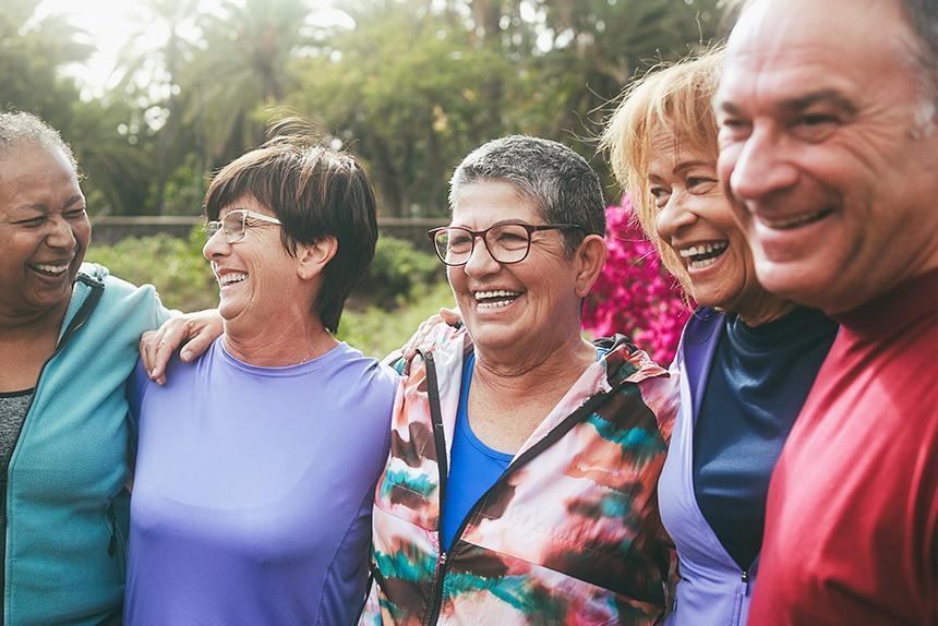 People standing in a group smiling.