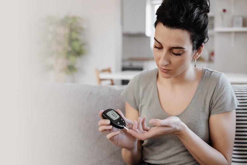 A woman with diabetes checking her insulin level