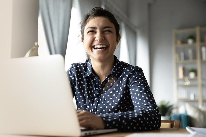Employee smiling as she works.