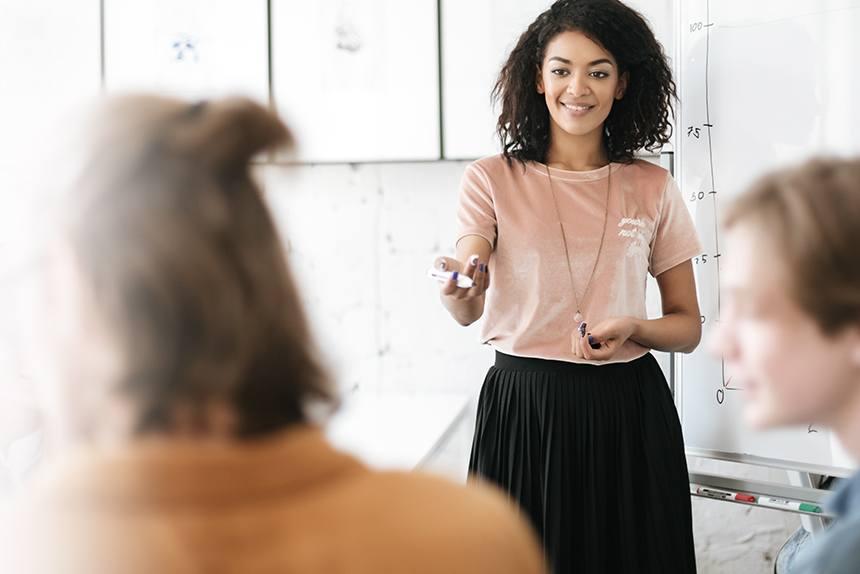 Woman teaching a class at work.