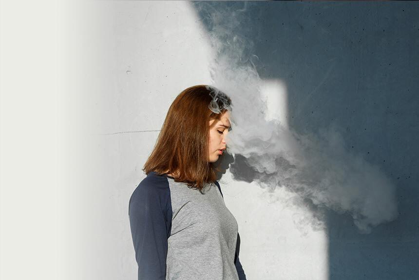 Teenage girl vaping